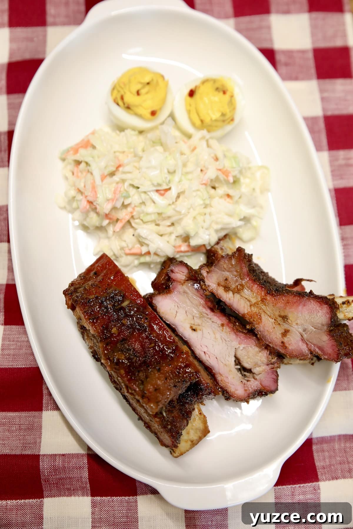 BBQ ribs with spicy maple sauce. Maple glazed spicy ribs with coleslaw and deviled eggs.