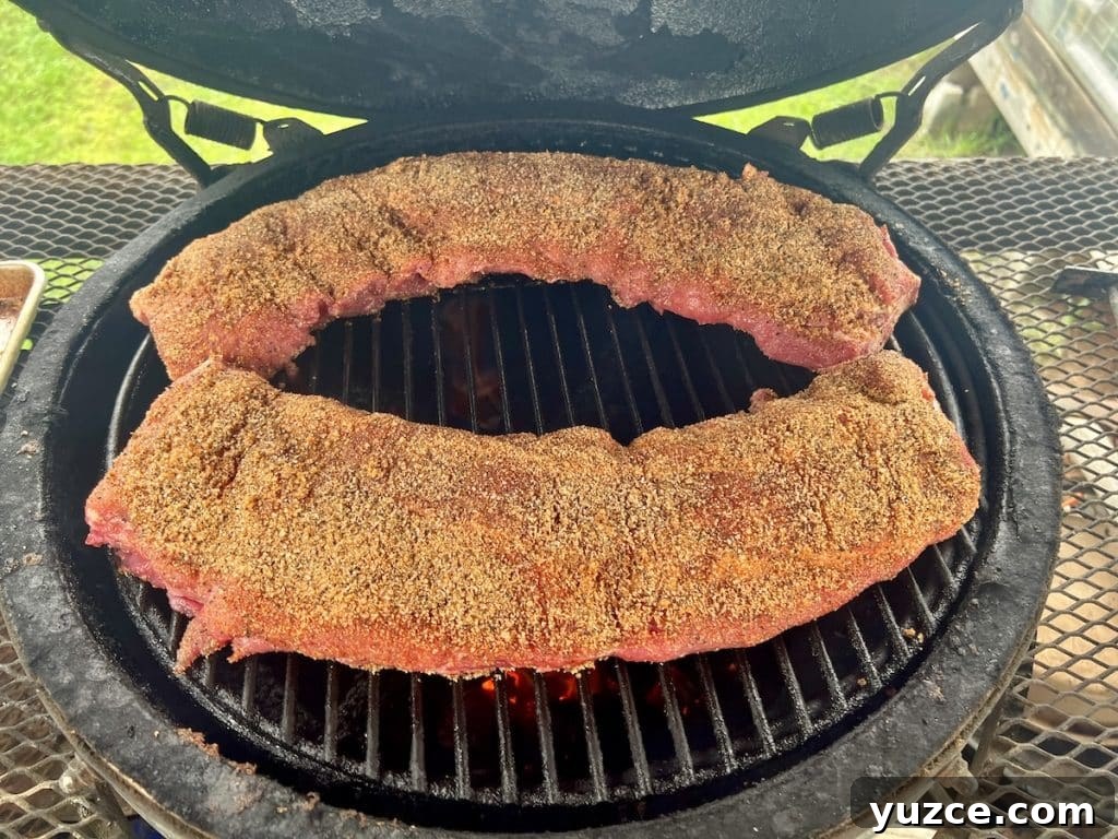 Spicy Maple-Glazed Ribs Recipe for Tangy, Caramelized Flavor 3 2 racks ribs on a Big Green Egg grill.