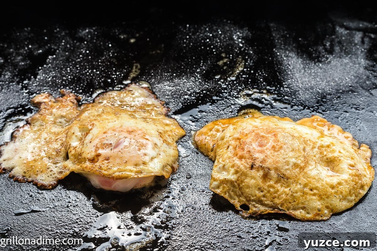 How to Make Over-Hard Eggs on a Blackstone Griddle 7 Cooked Eggs flipped to other side on the griddle