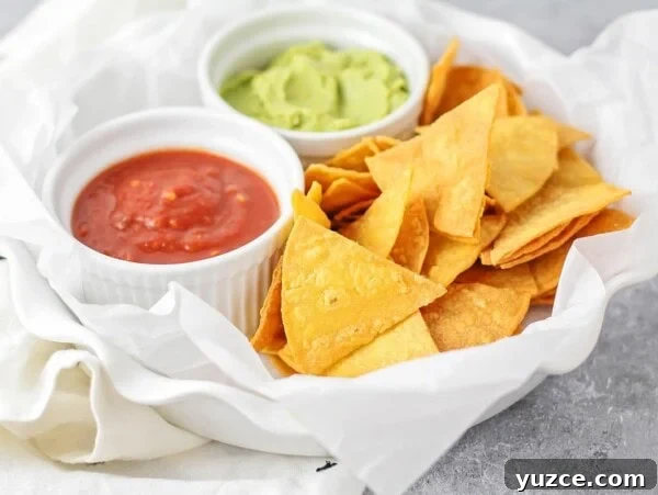 Zesty Black Bean and Corn Salsa Recipe for Fresh Homemade Dip 2 Homemade tortilla chips recipe in white basked with salsa and guacamole.