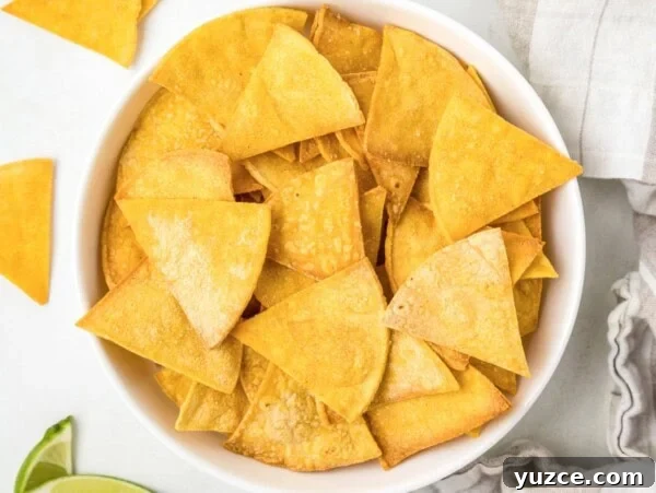 Zesty Black Bean and Corn Salsa Recipe for Fresh Homemade Dip 3 A white bowl filled with Homemade baked tortilla chips.