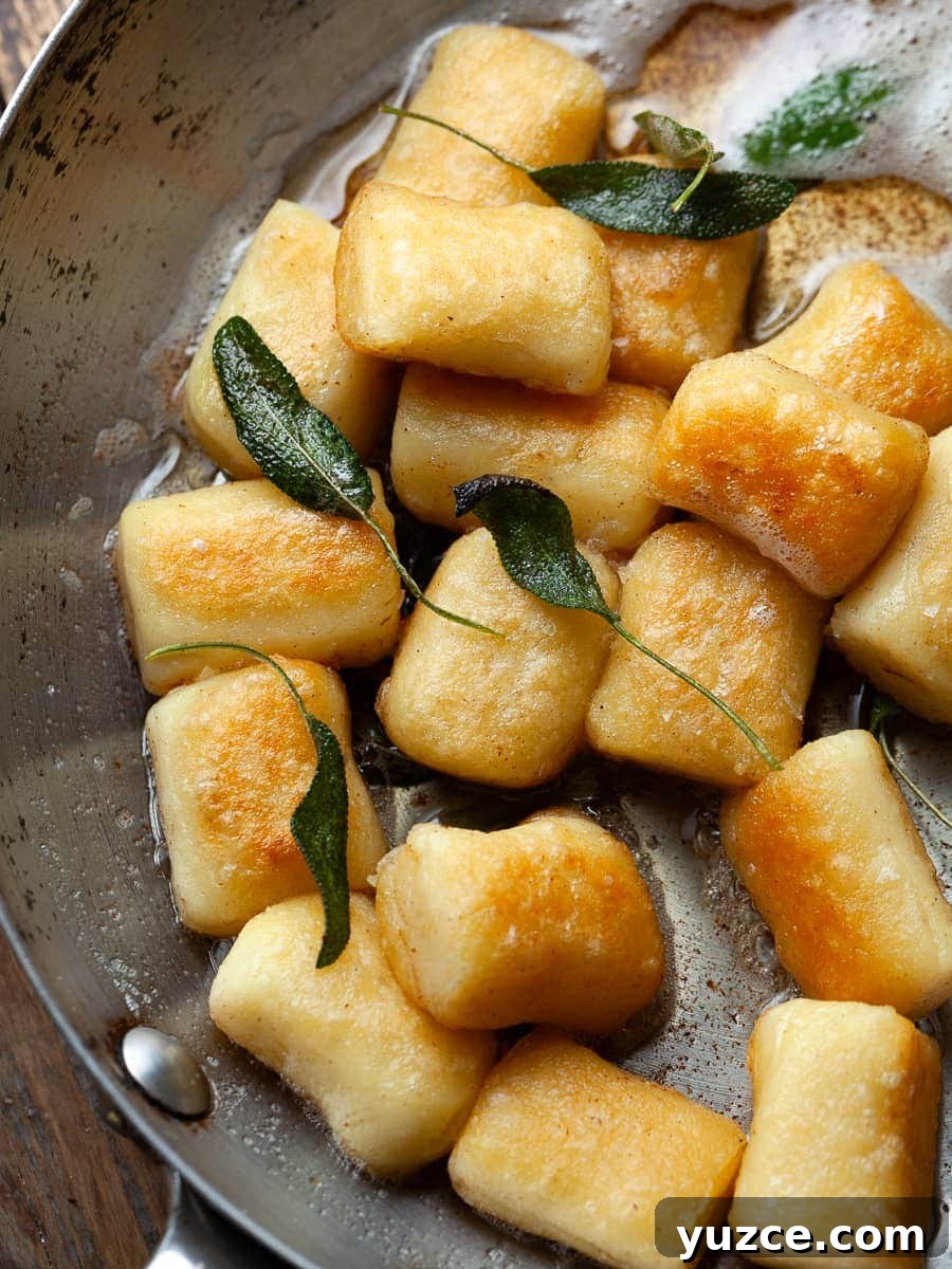 Homemade Gluten-Free Gnocchi Recipe for Tender Pillowy Dumplings 10 a bowl of homemade gluten free potato gnocchi with brown butter and sage, crispy gnocchi with fried sage