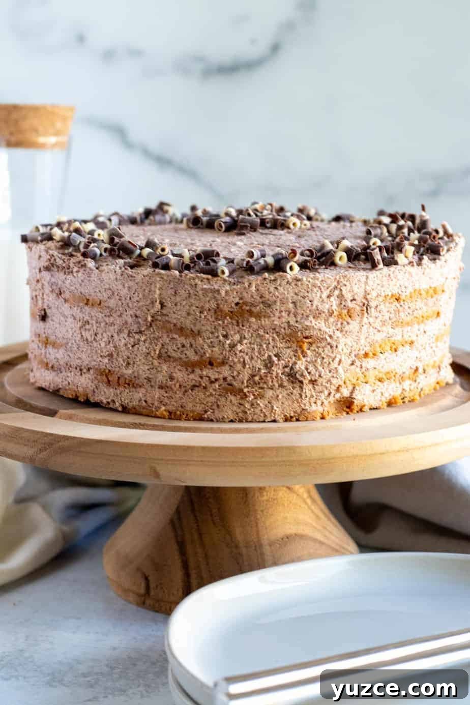 No-Bake Chocolate Icebox Cake Recipe for Creamy Layered Dessert 7 chocolate icebox cake on wood cake pedestal
