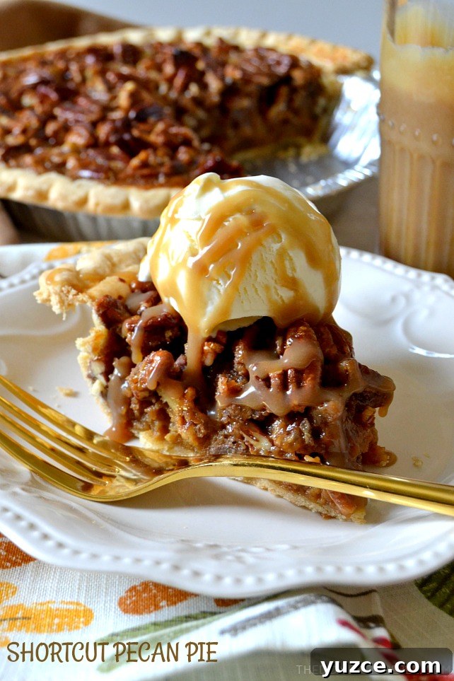 shortcut pecan pie slice on white plate with gold fork