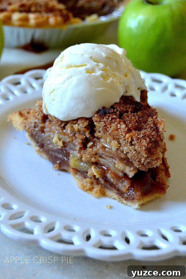 apple crisp pie slice on white plate with ice cream