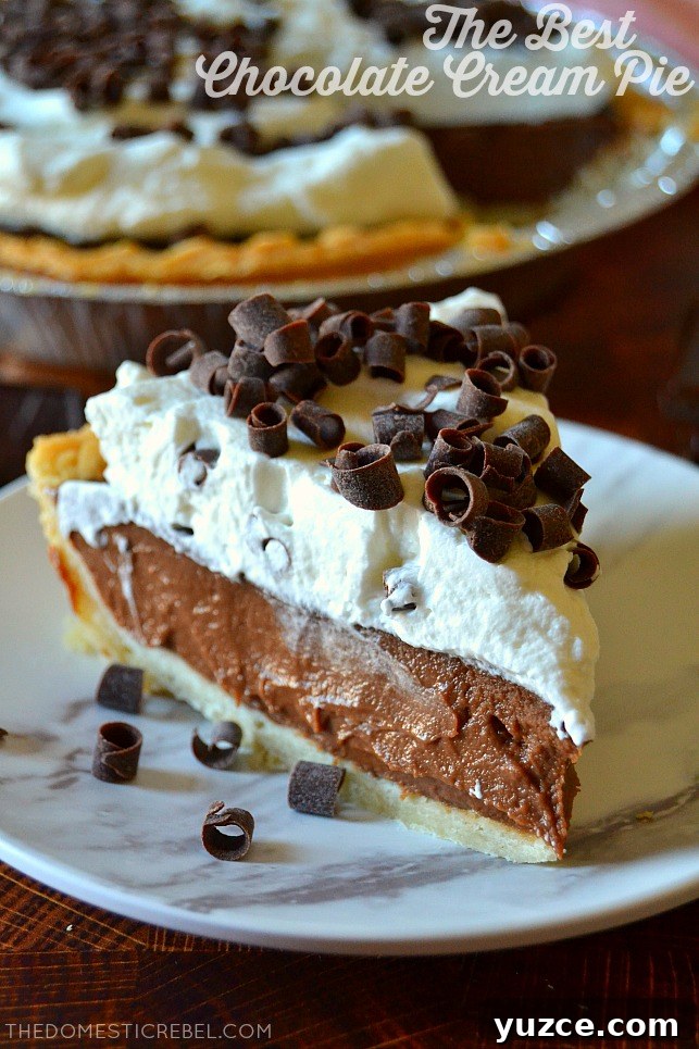 slice of chocolate cream pie on a white marble plate