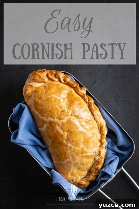 Authentic Cornish Pasty Recipe: Traditional Step-by-Step Guide 2 black background with blue cloth and golden Cornish pasty