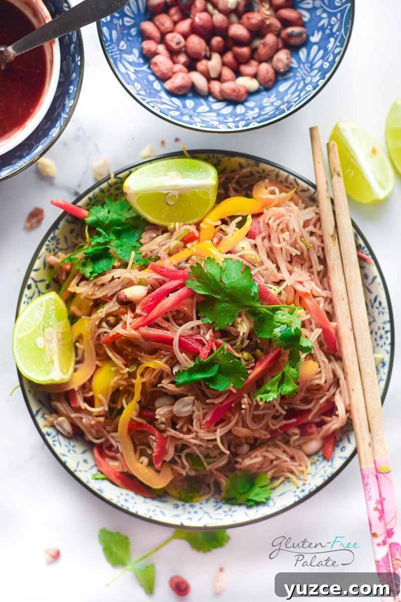 17 Delicious Gluten-Free Shrimp Recipes for Every Meal 5 gluten free pad thai on a plate with chop sticks