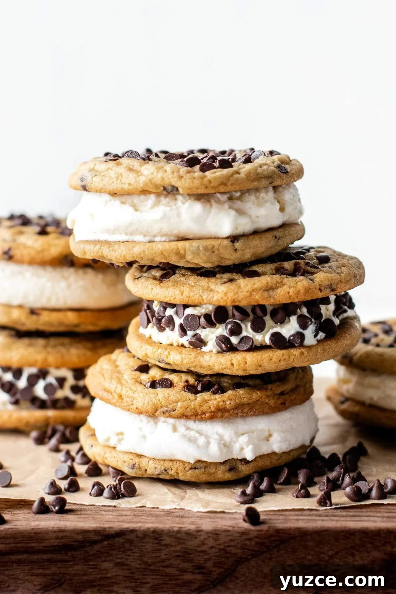 Chocolate Chip Ice Cream Sandwich Cookies Recipe for Homemade Treats 2 chocolate chip cookie ice cream sandwiches stacked on wooden serving board