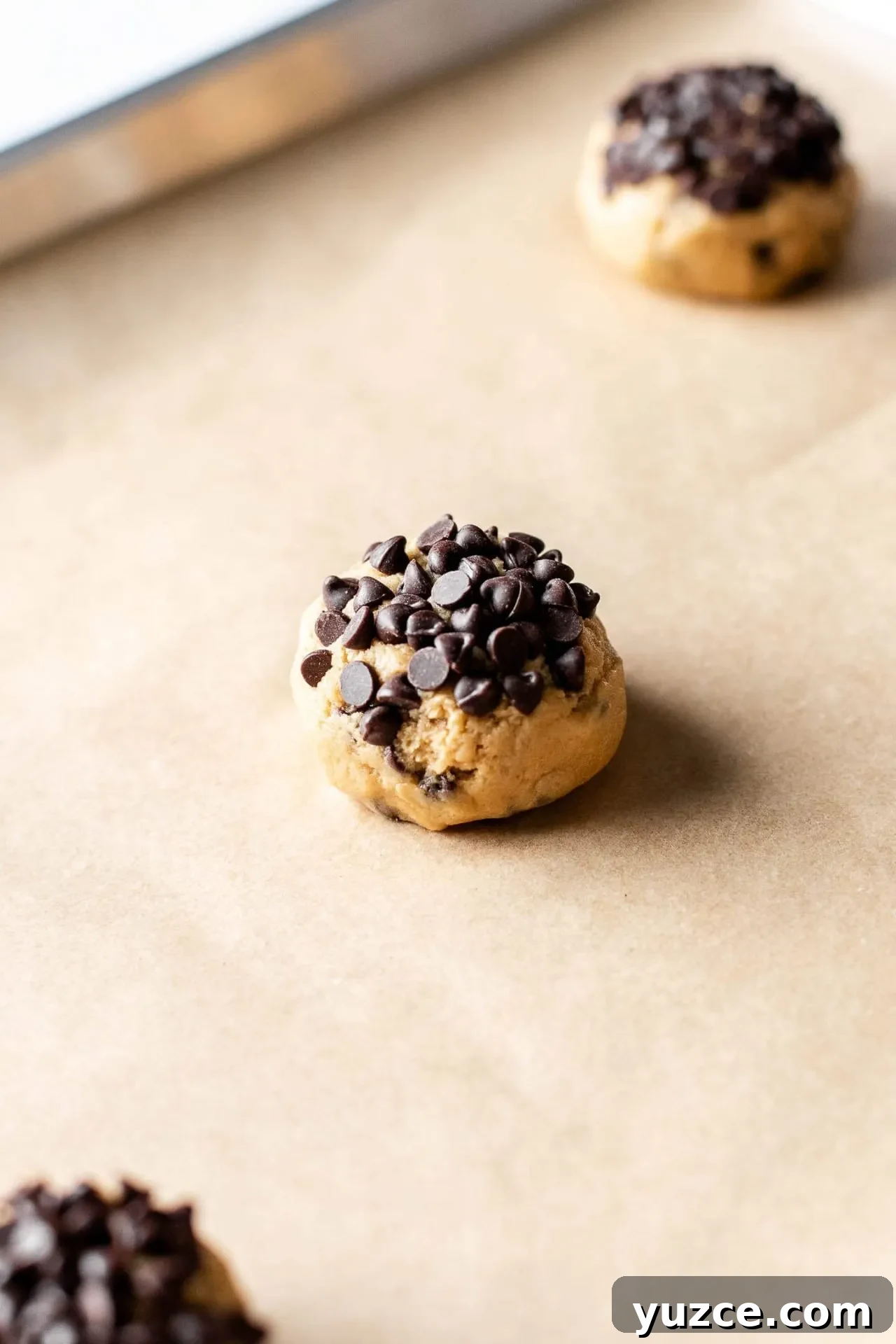 Chocolate Chip Ice Cream Sandwich Cookies Recipe for Homemade Treats 6 cookie dough ball on parchment lined baking sheet
