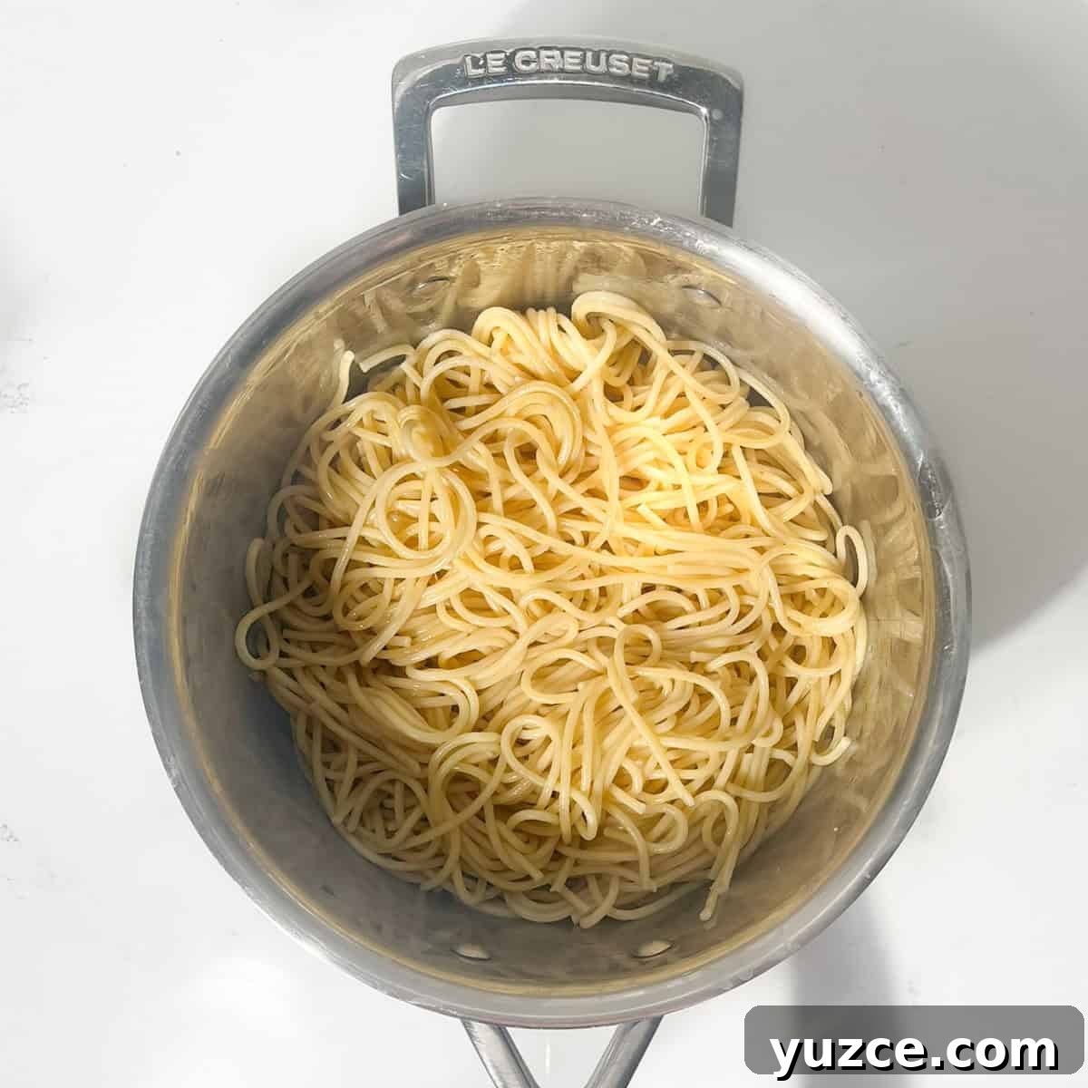 Spaghetti all’Arrabbiata Recipe: Spicy Tomato Pasta Guide 5 Cooked spaghetti in a large saucepan.