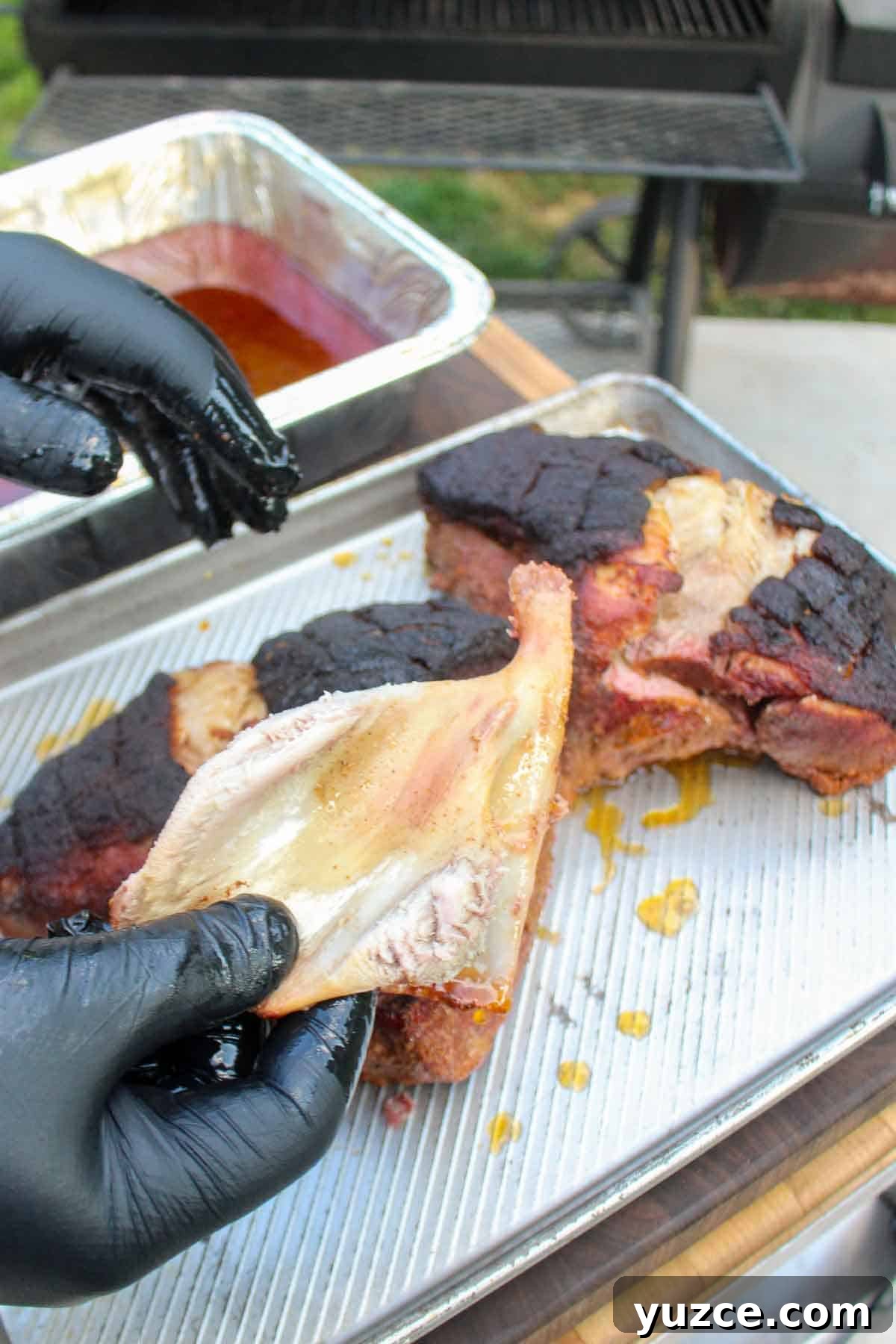 Smoky Pulled Pork BBQ Sandwich Recipe for Juicy Flavor 9 Clean bone pulled from the pork butts.