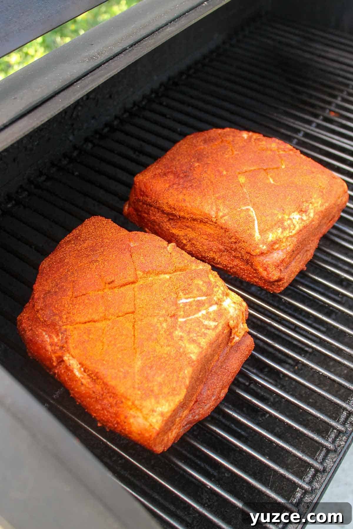 Smoky Pulled Pork BBQ Sandwich Recipe for Juicy Flavor 5 Seasoned pork butts on the smoker.