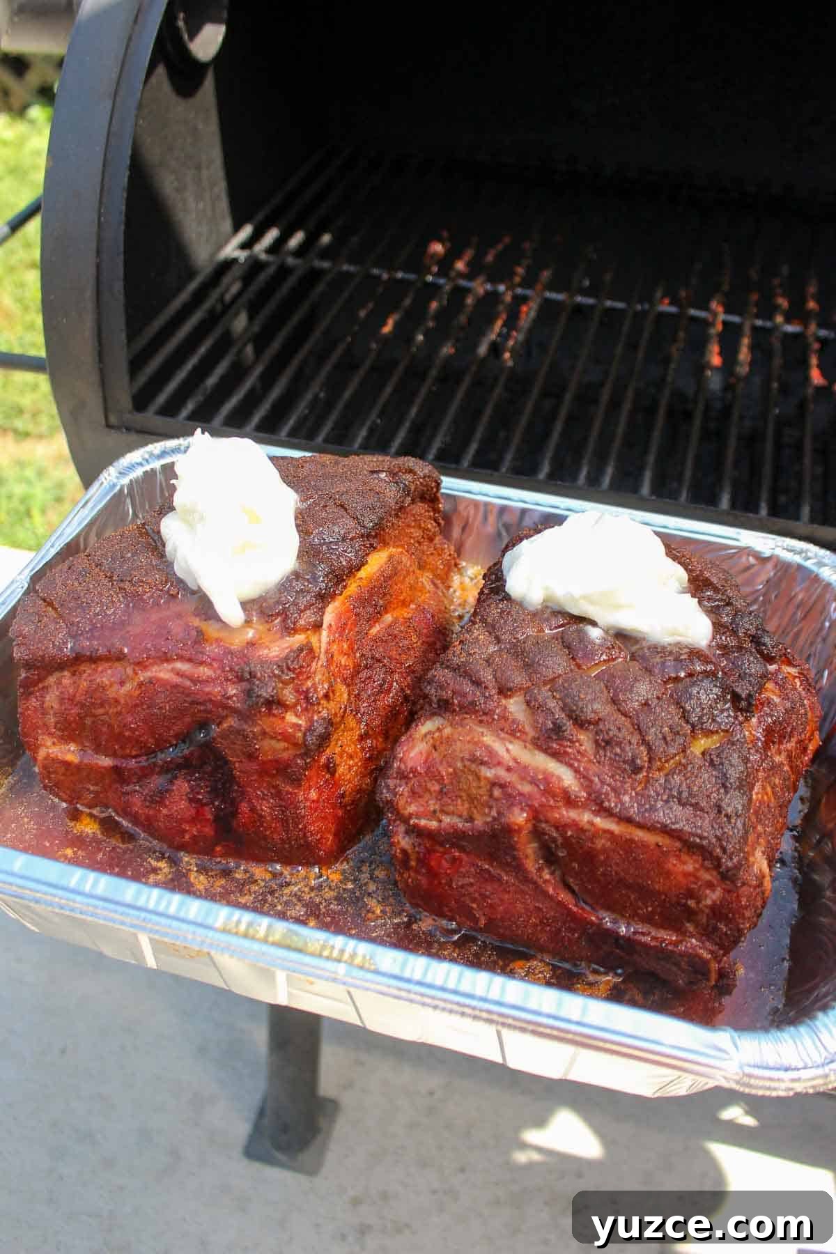 Smoky Pulled Pork BBQ Sandwich Recipe for Juicy Flavor 7 Adding pork fat and beer for the crutch on these Pulled Pork BBQ Sandwiches.