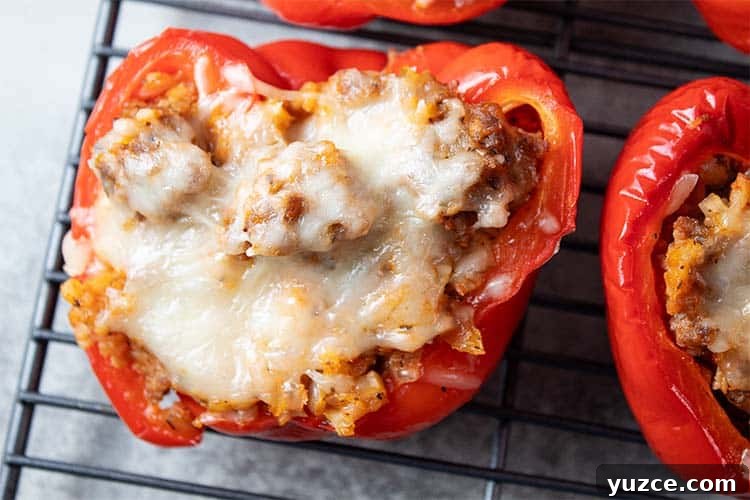 overhead closeup view of Italian sausage stuffed peppers on a wire cooling rack