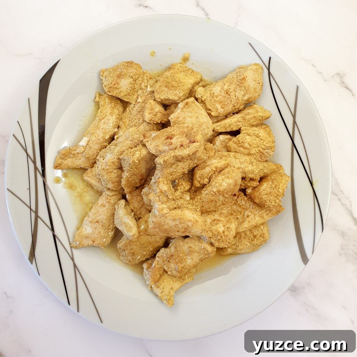 Creamy Murgh Makhani (Authentic Butter Chicken Recipe) 8 Cooked chicken breast pieces on a plate.