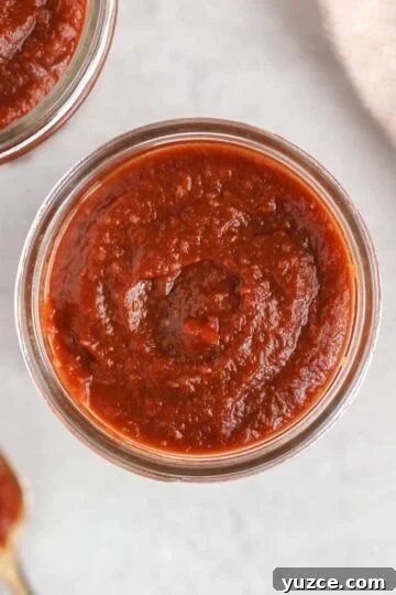 Overhead view of BBQ sauce in a mason jar.
