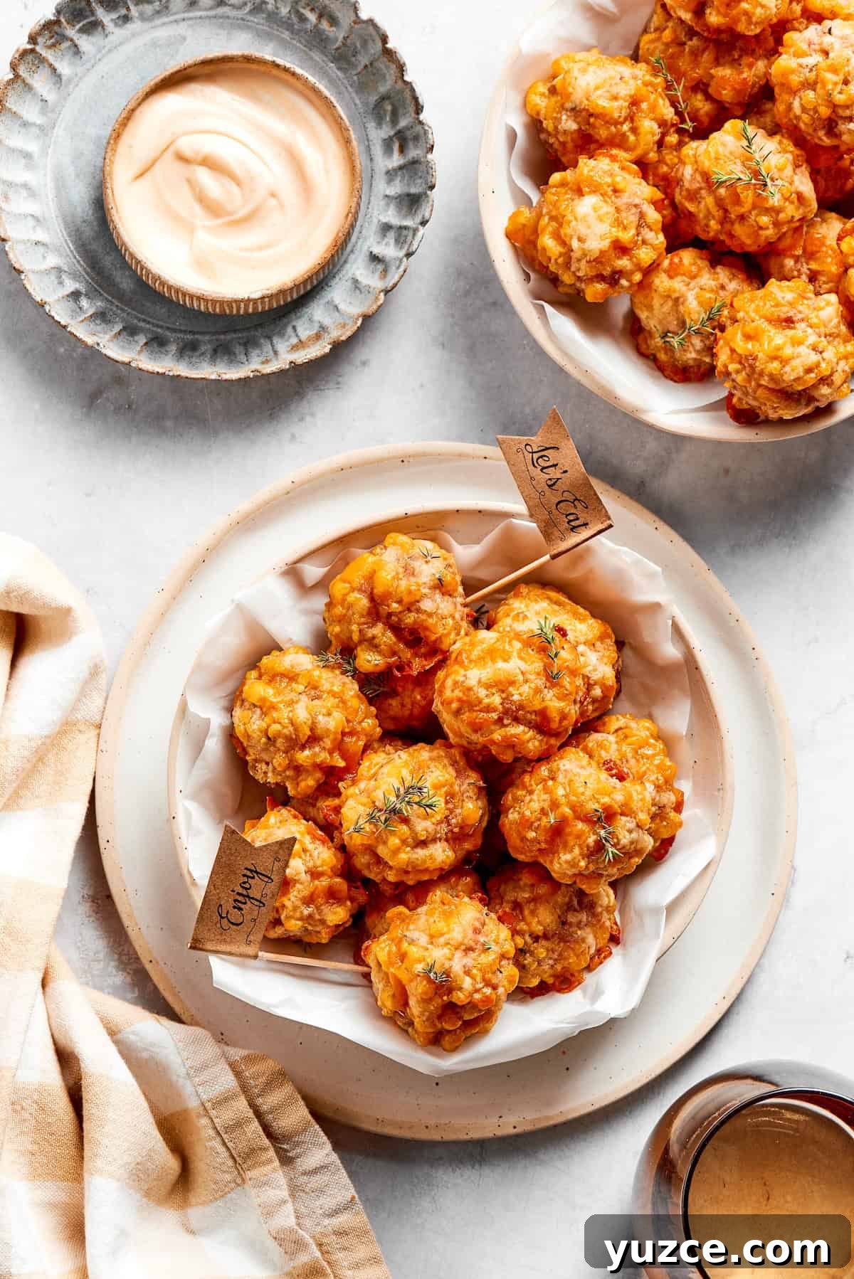 Bowls of sausage balls and dip.