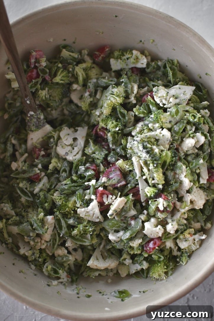 Crisp Snap Pea Salad with Lemon-Herb Vinaigrette 5 peas, broccoli, cauliflower, and tomatoes cut up and tossed with dressing.