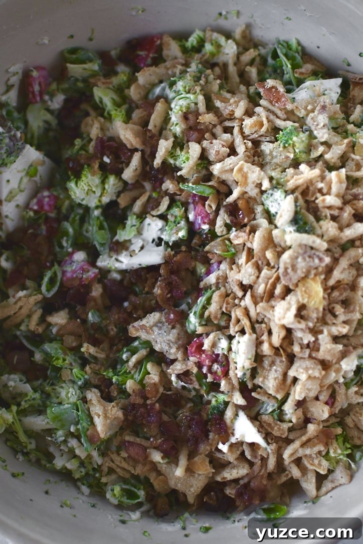 Crisp Snap Pea Salad with Lemon-Herb Vinaigrette 6 peas, broccoli, cauliflower, and tomatoes cut up and tossed with dressing. adding bacon and crispy onions to the bowl.