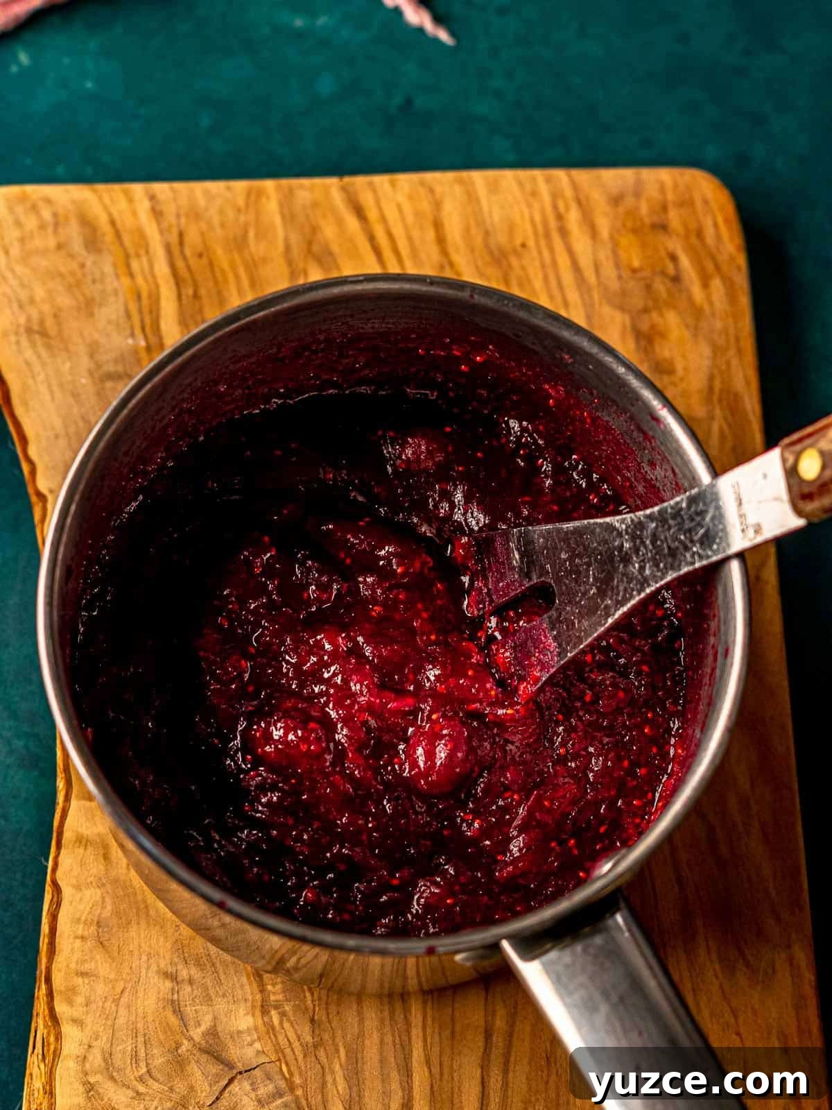 Cranberry Jalapeño Cream Cheese Dip Recipe for Holiday Parties 6 Cranberry sauce in a pan.