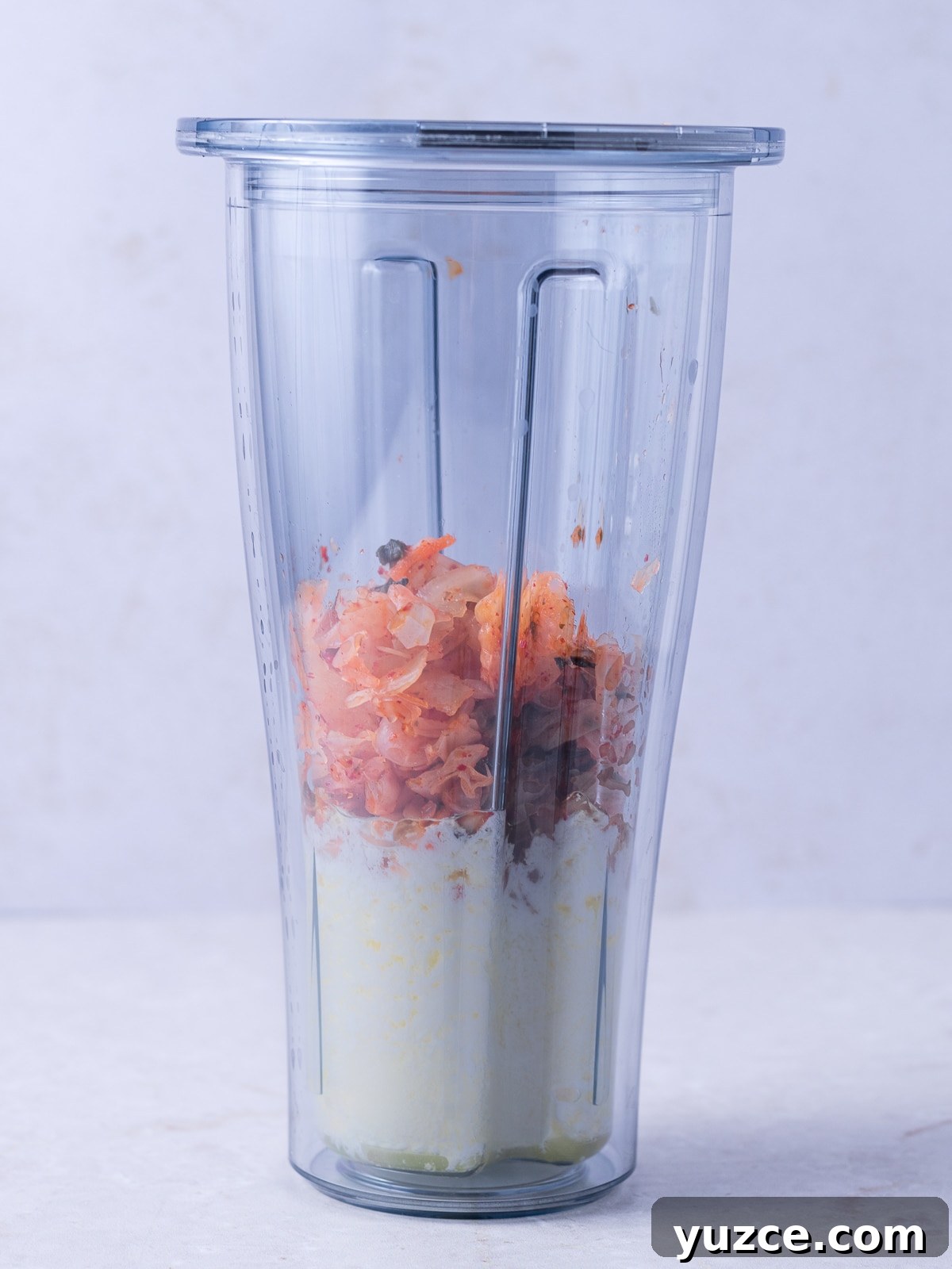 Spicy Kimchi Mayo Recipe for sandwiches, dips, and more 4 blender cup with kimchi and mayonnaise