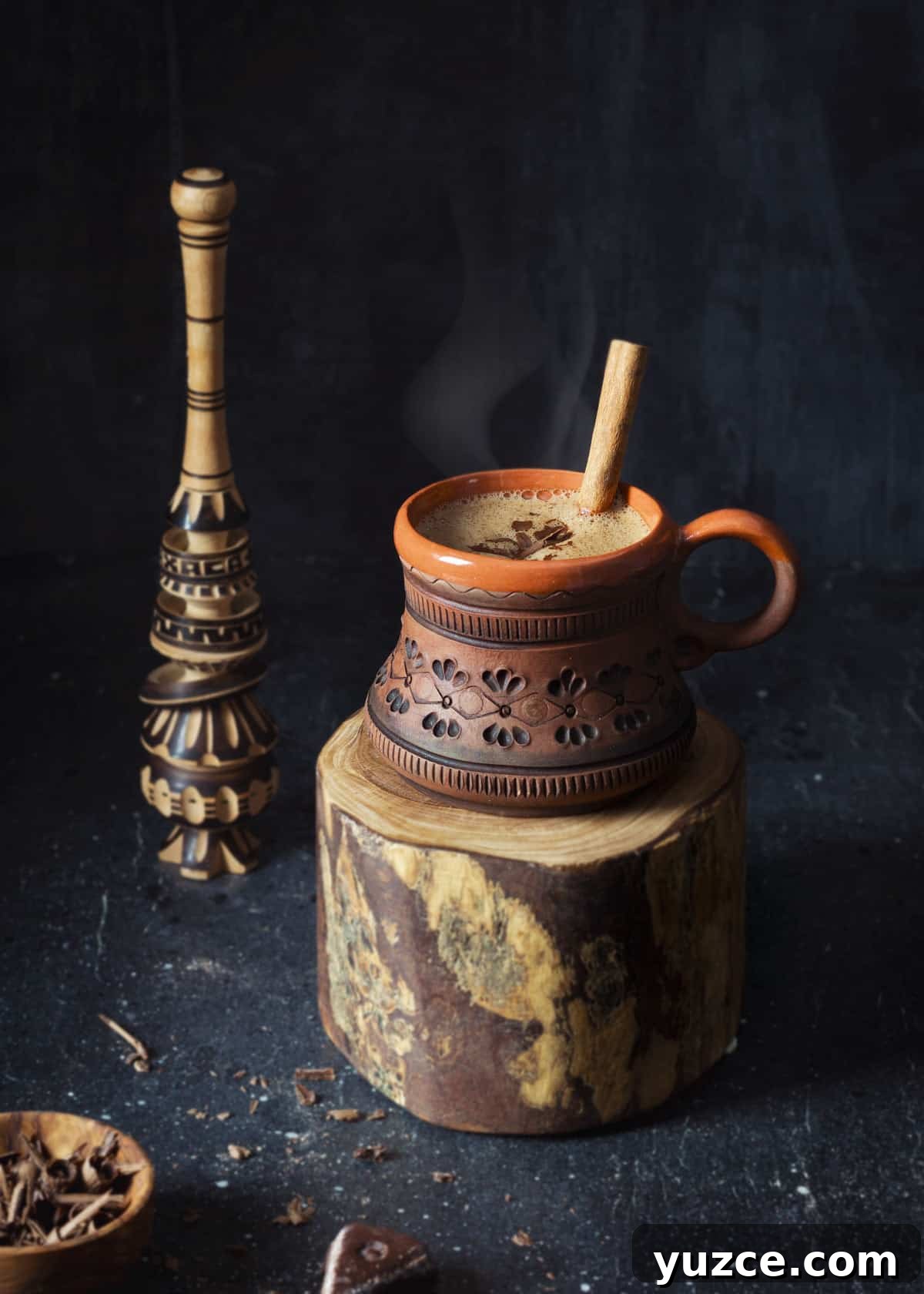 Oaxacan Hot Chocolate (Xocolatl): Authentic Mexican Recipe 6 Hot chocolate - Oaxacan style in a clay mug with Molinillo, a traditional Mexican wooden whisk.