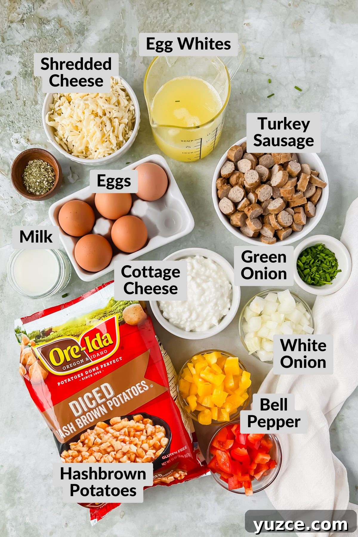 Ultimate Cheesy Loaded Hashbrown Casserole Recipe 3 ingredients for loaded hashbrown casserole in individual bowls on gray background.