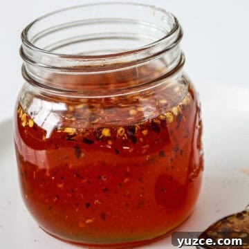 Hot honey sauce in a glass jar.