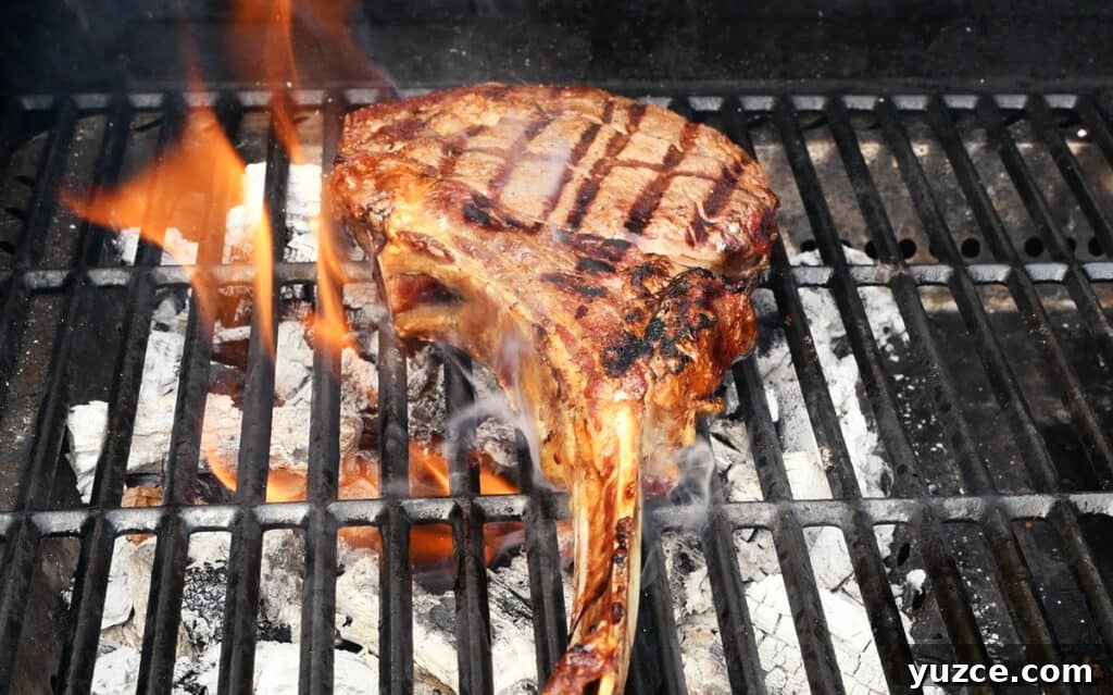 Perfect Reverse Sear Steak Technique for Tender, Crispy Results 3 tomahawk steak on the grill