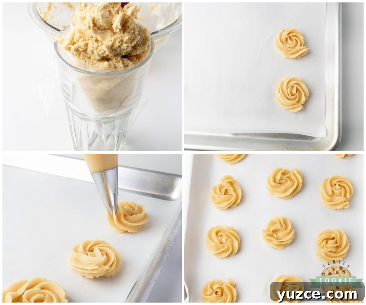 Piping butter cookies onto parchment paper.