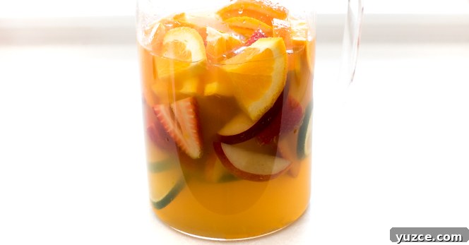 Refreshing White Wine Sangria Recipe with Fresh Fruit 4 white wine sangria recipe in clear pitcher