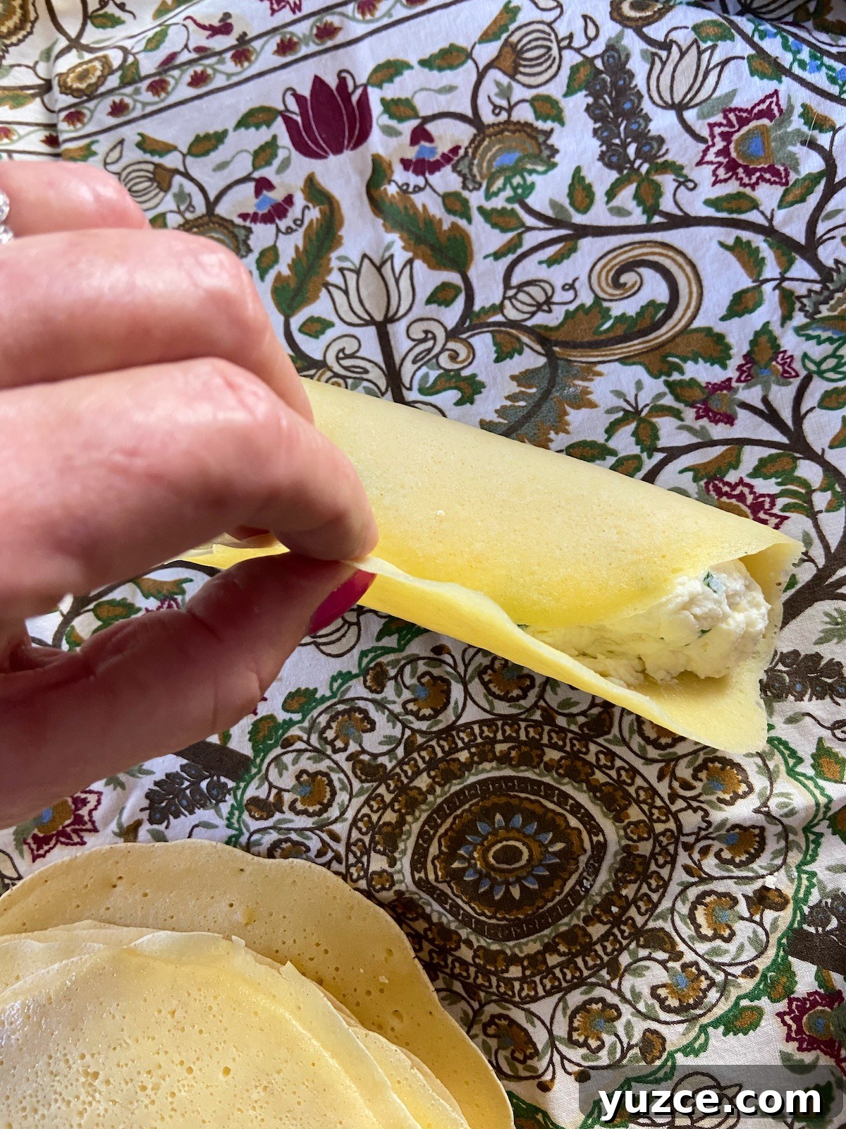 Three-Cheese Manicotti Crepes: Stuffed Italian Recipe 7 Rolled and filled manicotti crepe.