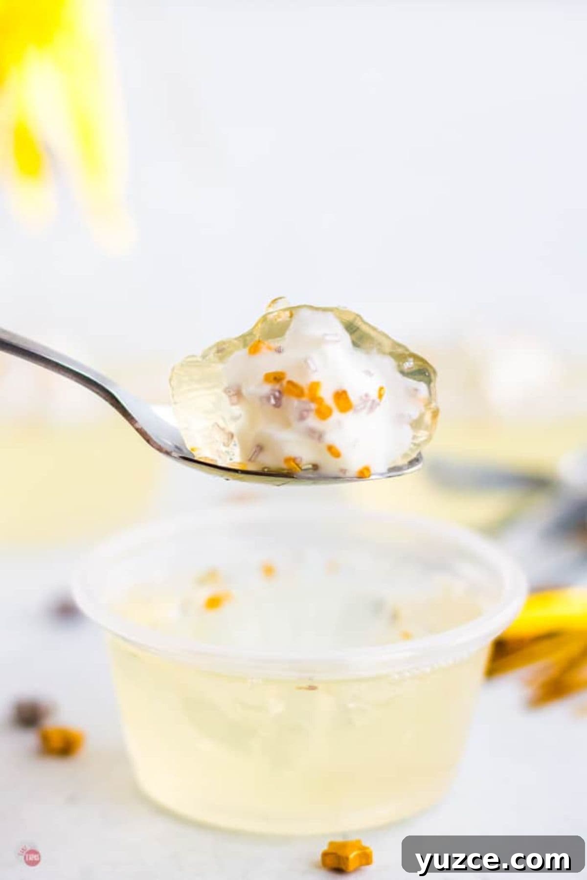 Champagne Jello Shots Recipe: Fizzy Party Cocktail Bites 9 spoon with jello on it