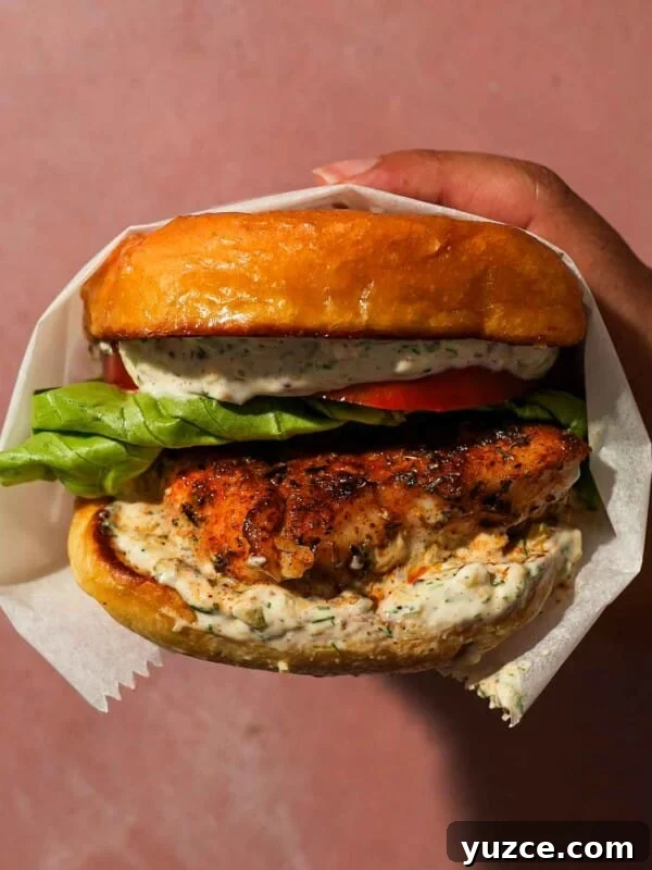 Dijon-Baked Salmon with Fresh Dill and Lemon 8 Blackened fish sandwich layered with lettuce, tomato, and creamy tartar sauce.