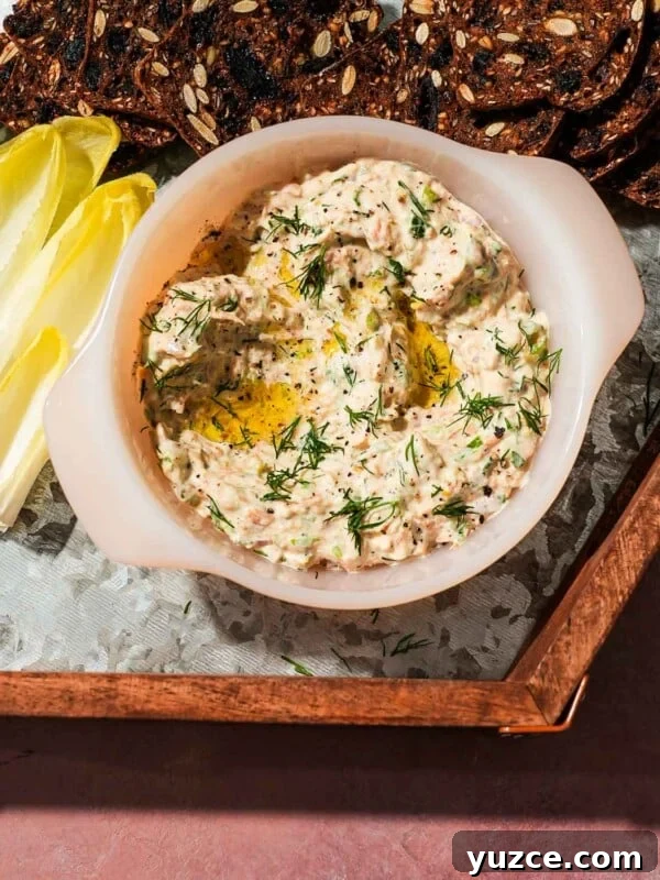 Dijon-Baked Salmon with Fresh Dill and Lemon 10 White bowl of smoked trout dip surrounded by endive leaves and crispbread slices.