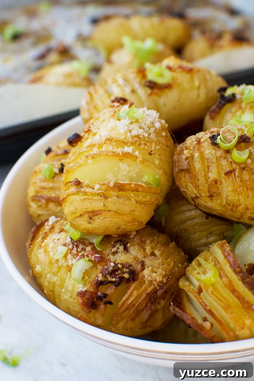 mini garlic & parmesan hasselback potatoes A close-up bowl of mini parmesan and garlic hasselback potatoes