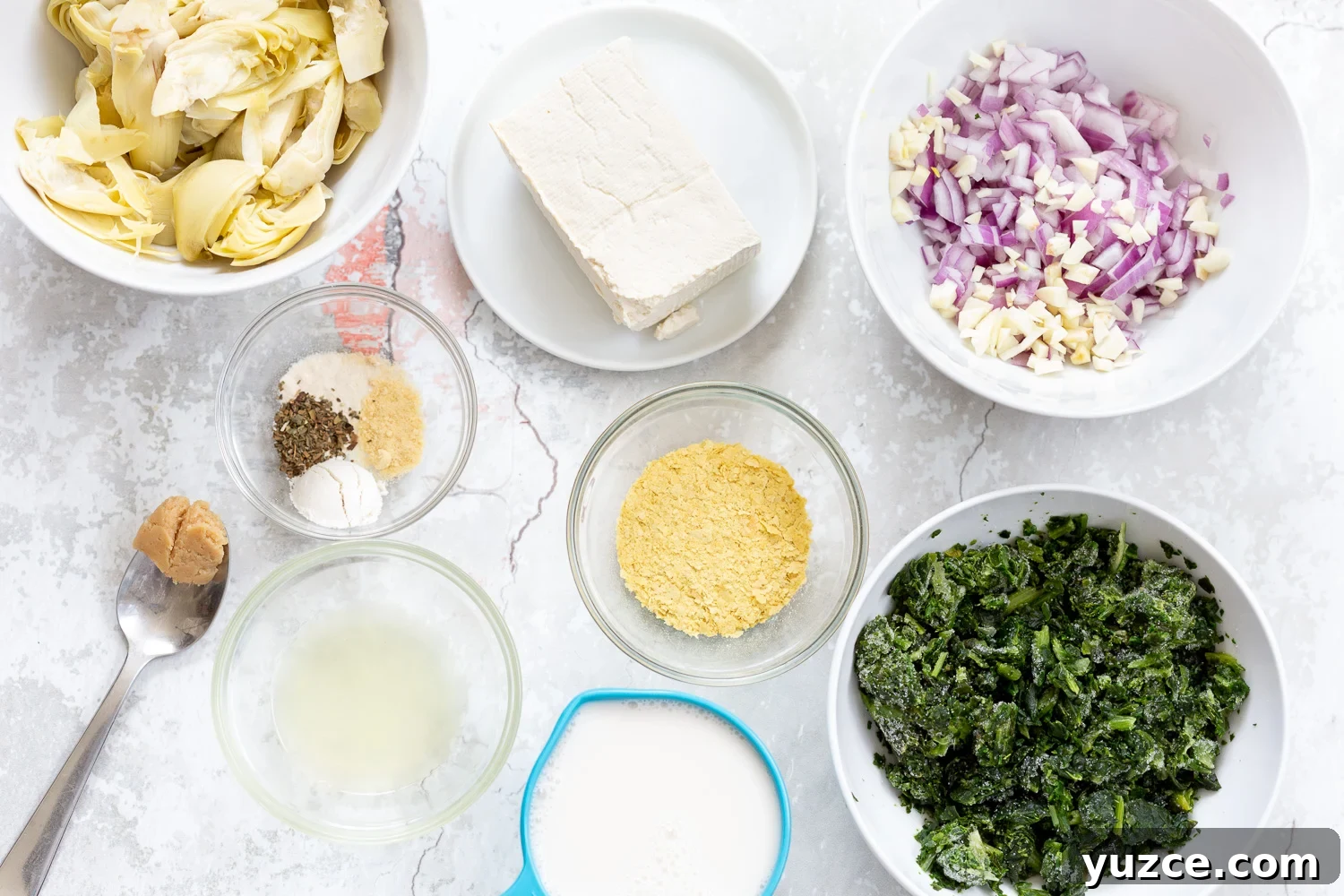 spinach pasta recipe overhead shot of ingredients needed for making spinach artichoke pasta bake
