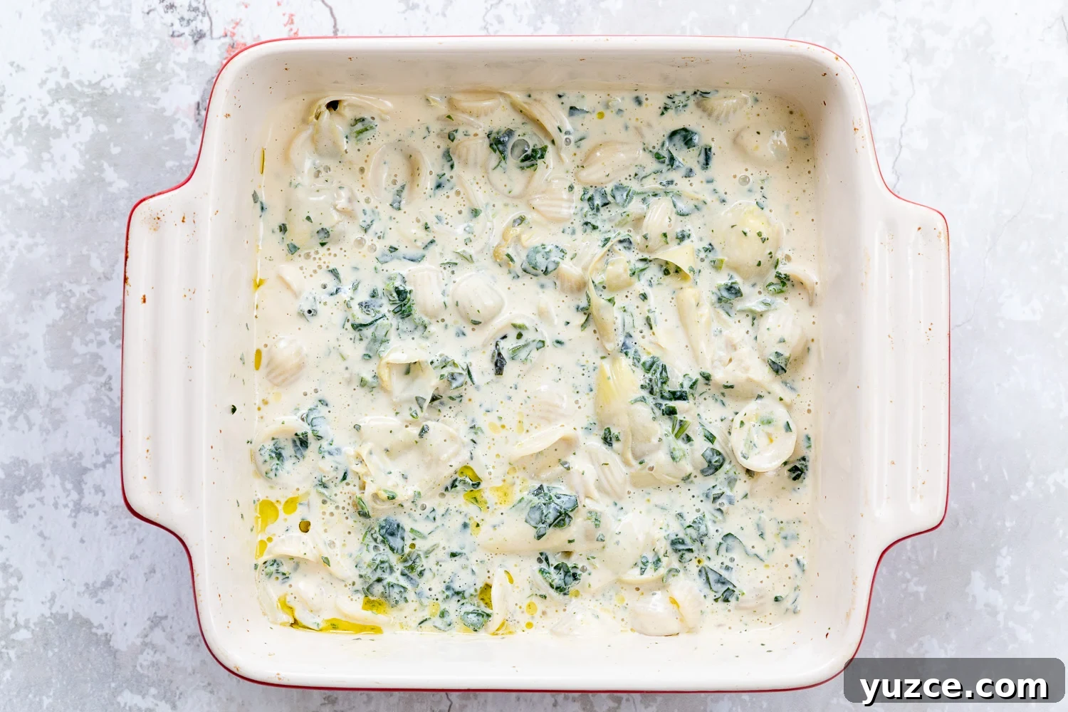 spinach pasta recipe spinach artichoke pasta bake ready to go in the oven