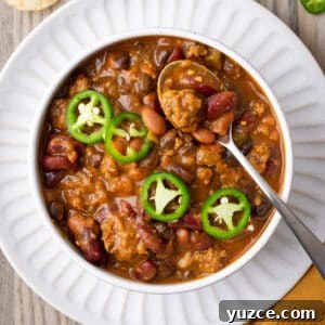 Spiced Pumpkin Chili with Turkey and Beans 14 A bowl of pumpkin chili topped with sliced jalapenos.