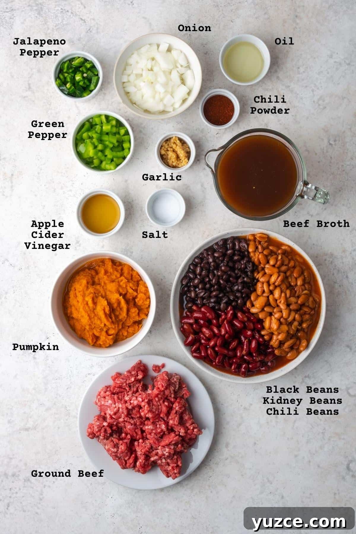 pumpkin chili recipe Ingredients for pumpkin chili on a white table.