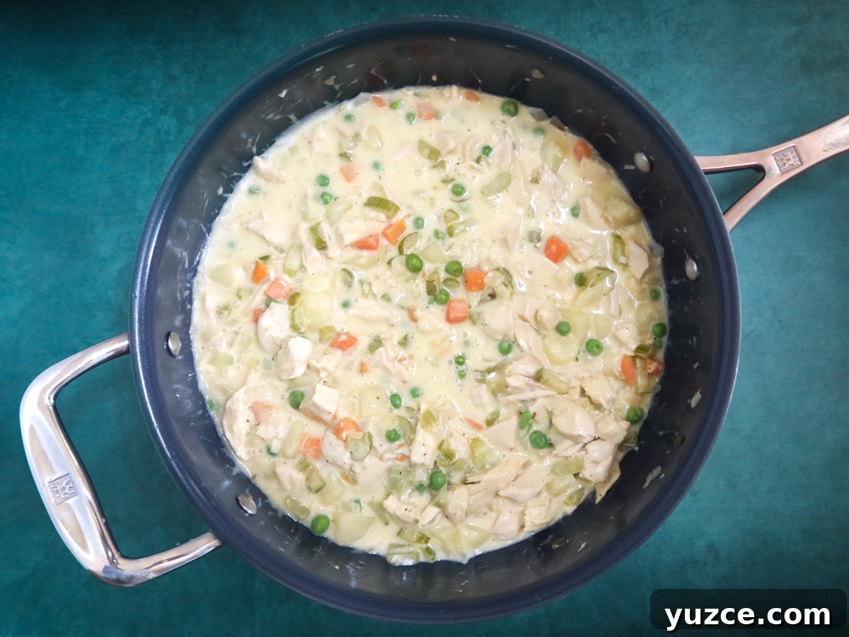 Patchwork Puff Pastry Chicken Pot Pie with Golden Crust 4 chicken pot pie filling in the skillet