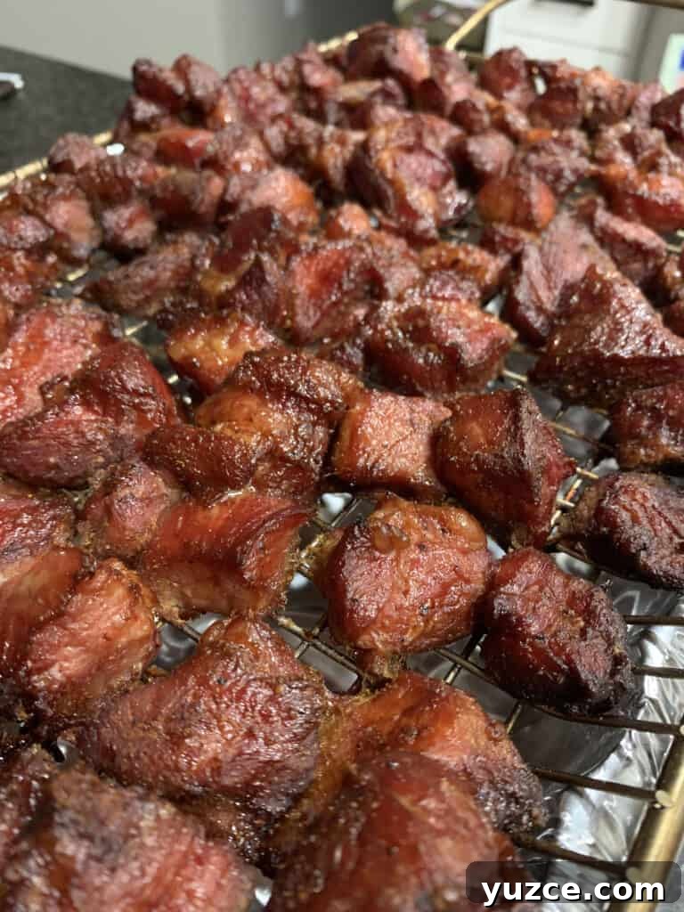 Smoky Pork Shoulder Burnt Ends Recipe for Tender, Crispy Bites 4 pork shoulder chunks after smoking for 6 hours