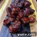 Smoky Pork Shoulder Burnt Ends Recipe for Tender, Crispy Bites 8 Pork Shoulder Burnt Ends on a cutting board