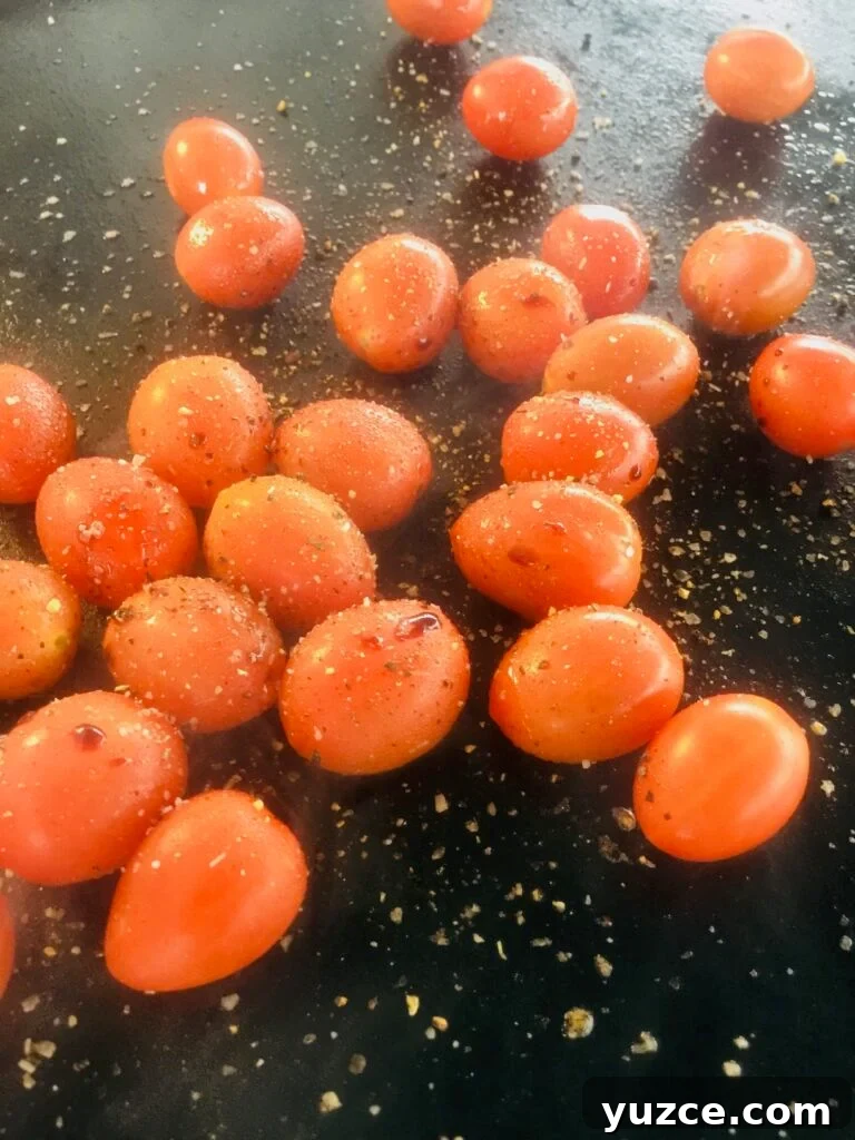 tomatoes on griddle before cooking