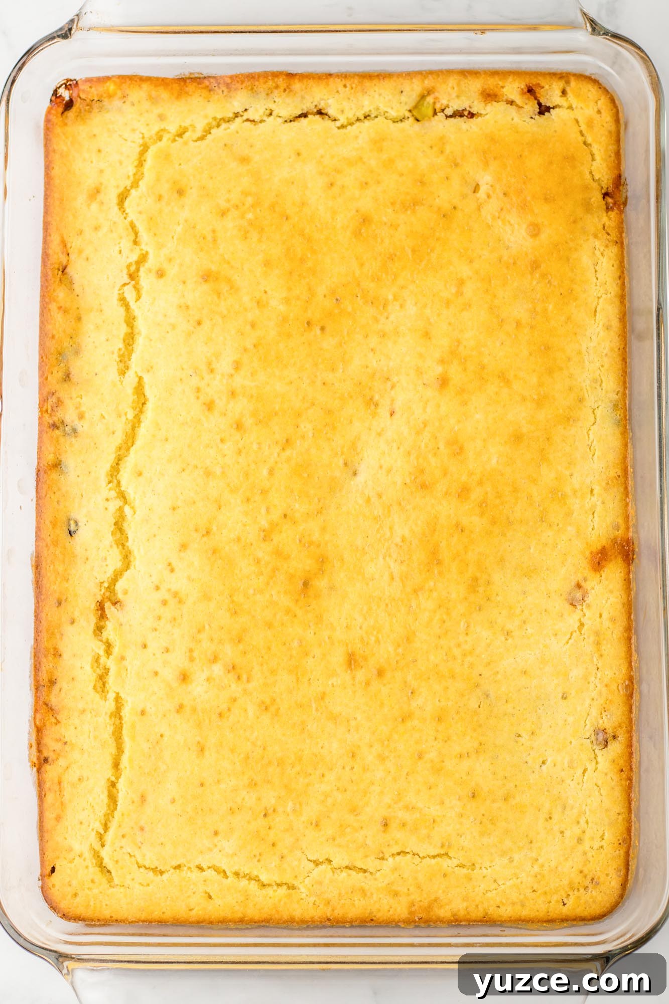 Creamy Cornbread Casserole with Cheesy Corn Topping 9 Baked cornbread casserole, overhead shot