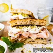Classic Italian Mortadella Sandwich Recipe — Quick Lunch Idea 17 Assembled Mortadella Sandwich with Pistachio Pesto and Burrata with pesto on the side.