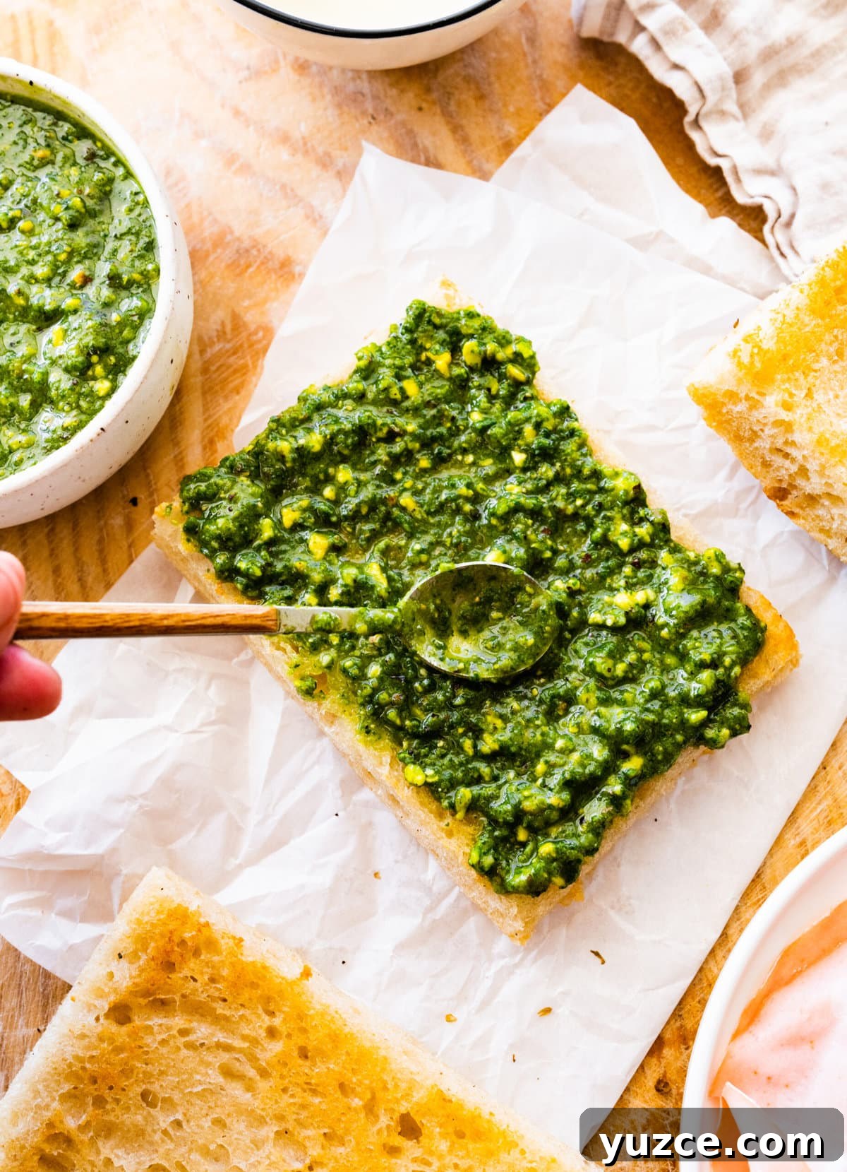 Classic Italian Mortadella Sandwich Recipe — Quick Lunch Idea 8 How to make Mortadella Sandwich Recipe with Pistachio Pesto and Burrata (step-by-step): spreading the pesto on the focaccia.