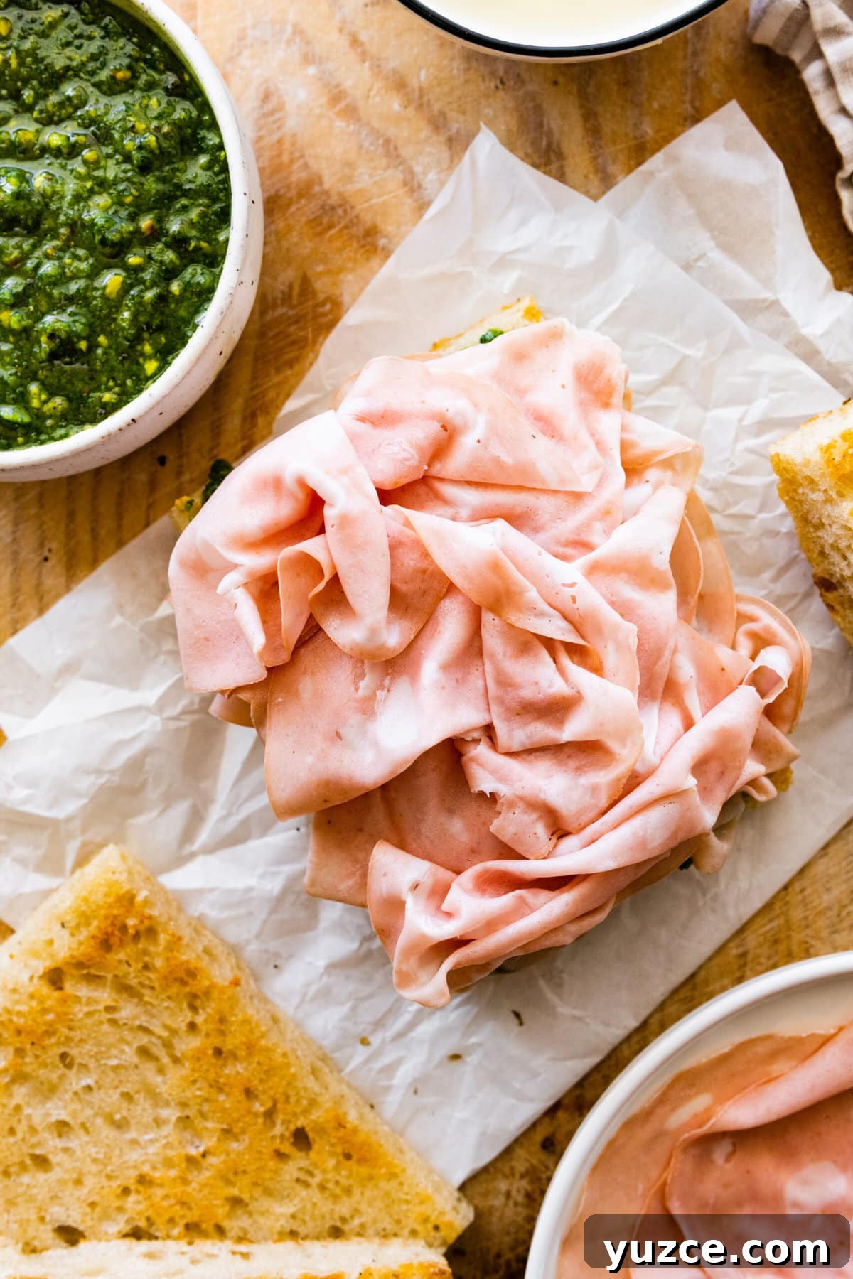 Classic Italian Mortadella Sandwich Recipe — Quick Lunch Idea 9 Thin slices of Mortadella on bread with pesto.