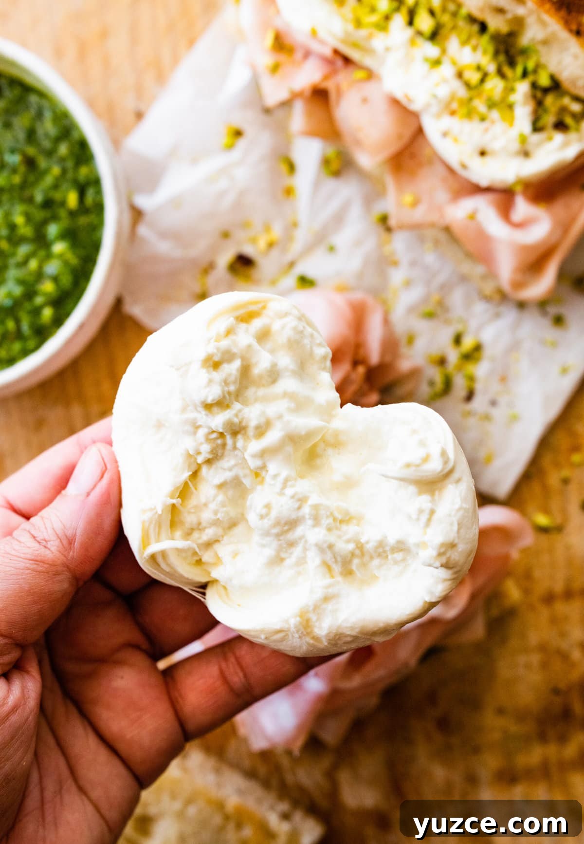 Classic Italian Mortadella Sandwich Recipe — Quick Lunch Idea 10 Person pulling apart burrata cheese.